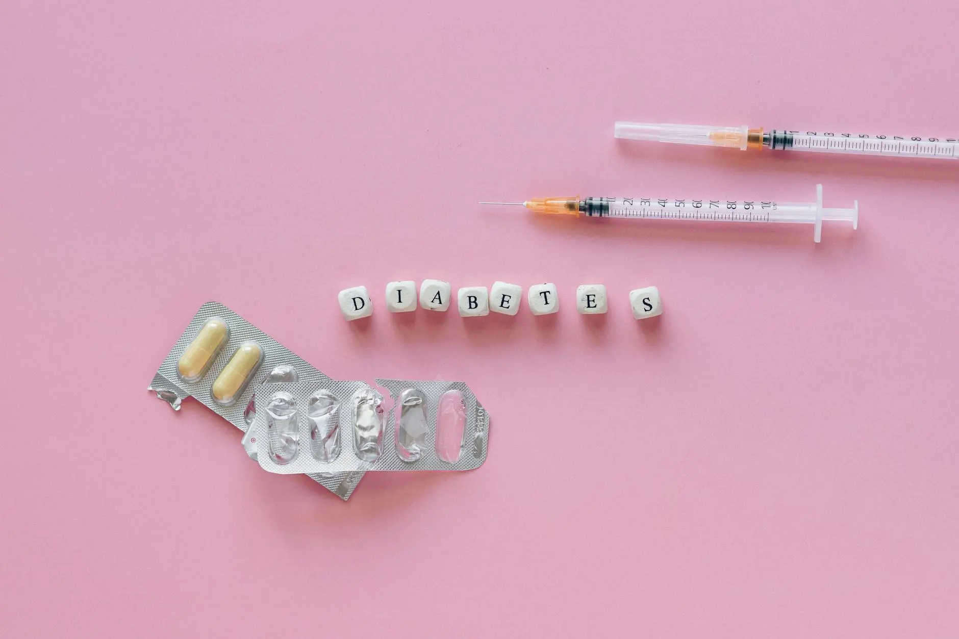 White and Black Letter Blocks spelling diabetes on Pink Background